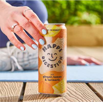 A hand reaching for a Happi can